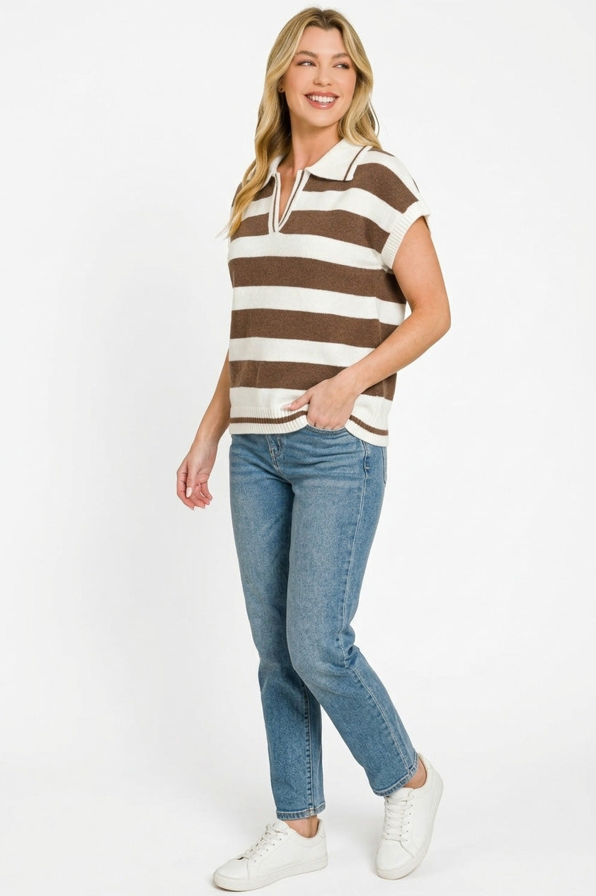 Woman wearing a brown and white striped shirt with blue jeans on a white background