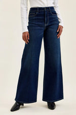 Woman wearing Judy Blue High-Waisted Wide-Leg Dark Wash Jeans