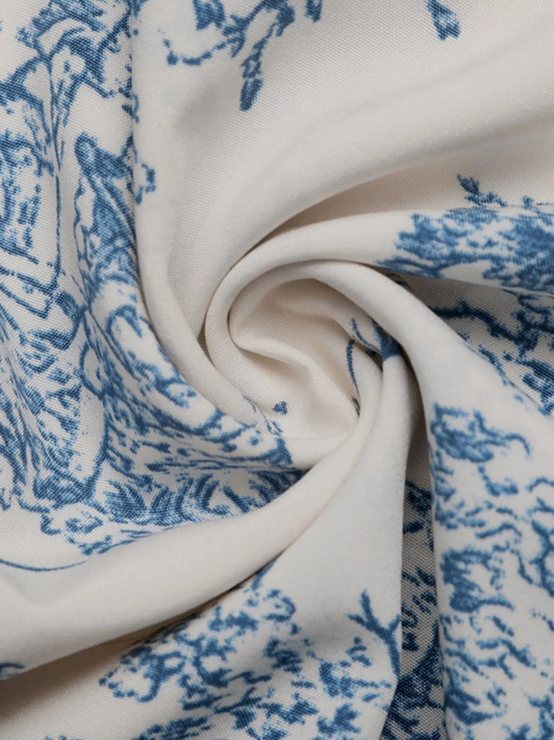 Close-up of white fabric with blue floral pattern
