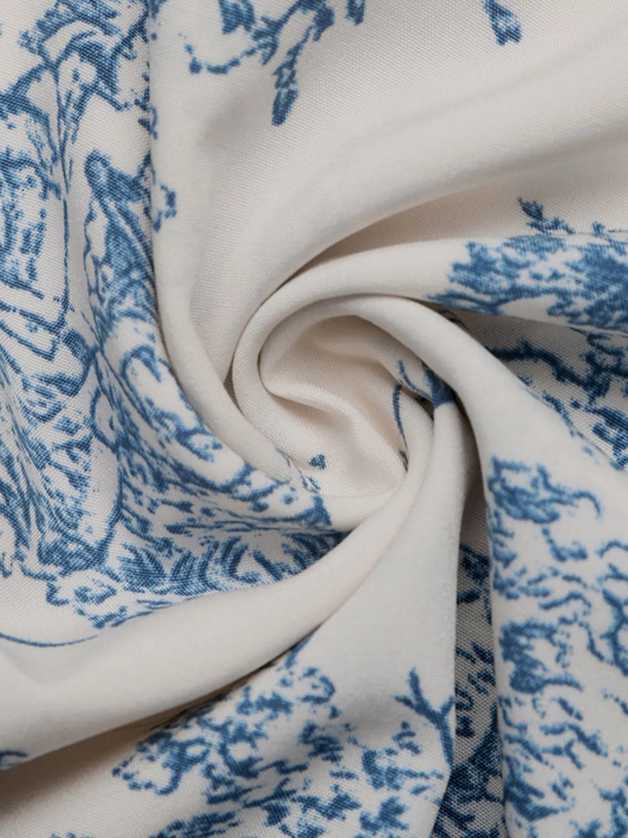 Close-up of white fabric with blue floral pattern