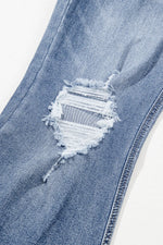 View of knee on Distressed Raw Hem Bootcut Jeans