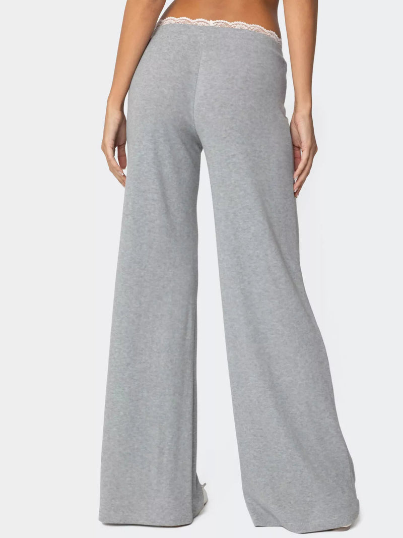 Gray wide-leg pants worn by a person on a white background
