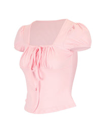Pink top with puff sleeves on a white background