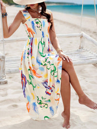 Woman in a colorful dress sitting on a beach swing with a scenic background.