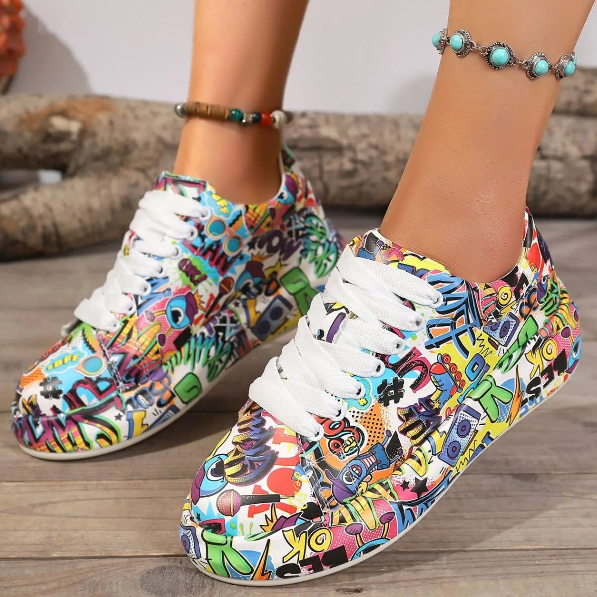 Colorful patterned sneakers with white laces on a wooden floor.