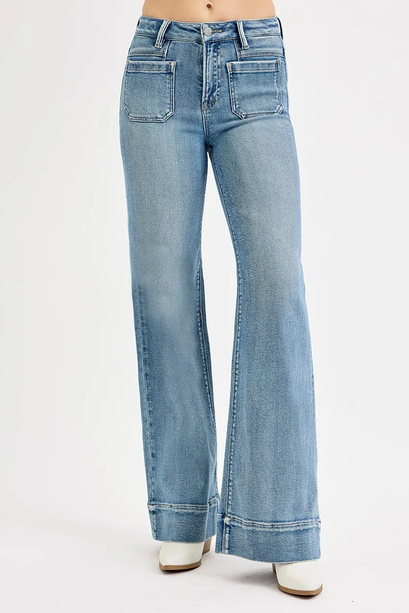 Light blue flared jeans on a white background