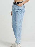 Light blue jeans worn by a person on a white background