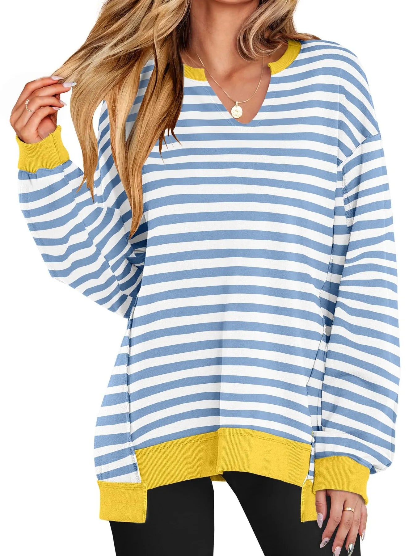 Blue and white striped sweater with yellow accents worn by a person