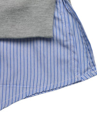 Close-up of a folded gray shirt and blue striped fabric on a white background