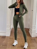Person wearing a green athletic outfit with white sneakers in an indoor setting.
