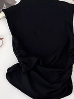 Black fabric with a bow on a white background