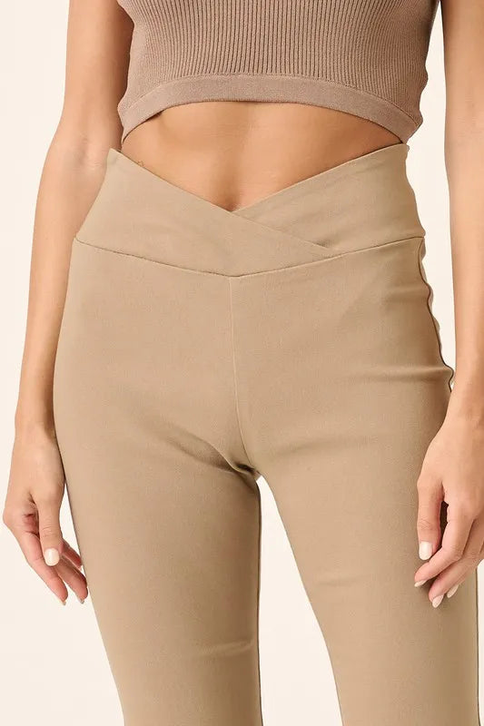 Beige leggings worn by a person on a beige background