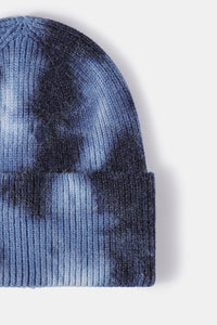 Blue tie-dye beanie on a white background