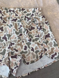 Camouflage-patterned fabric on a flat surface
