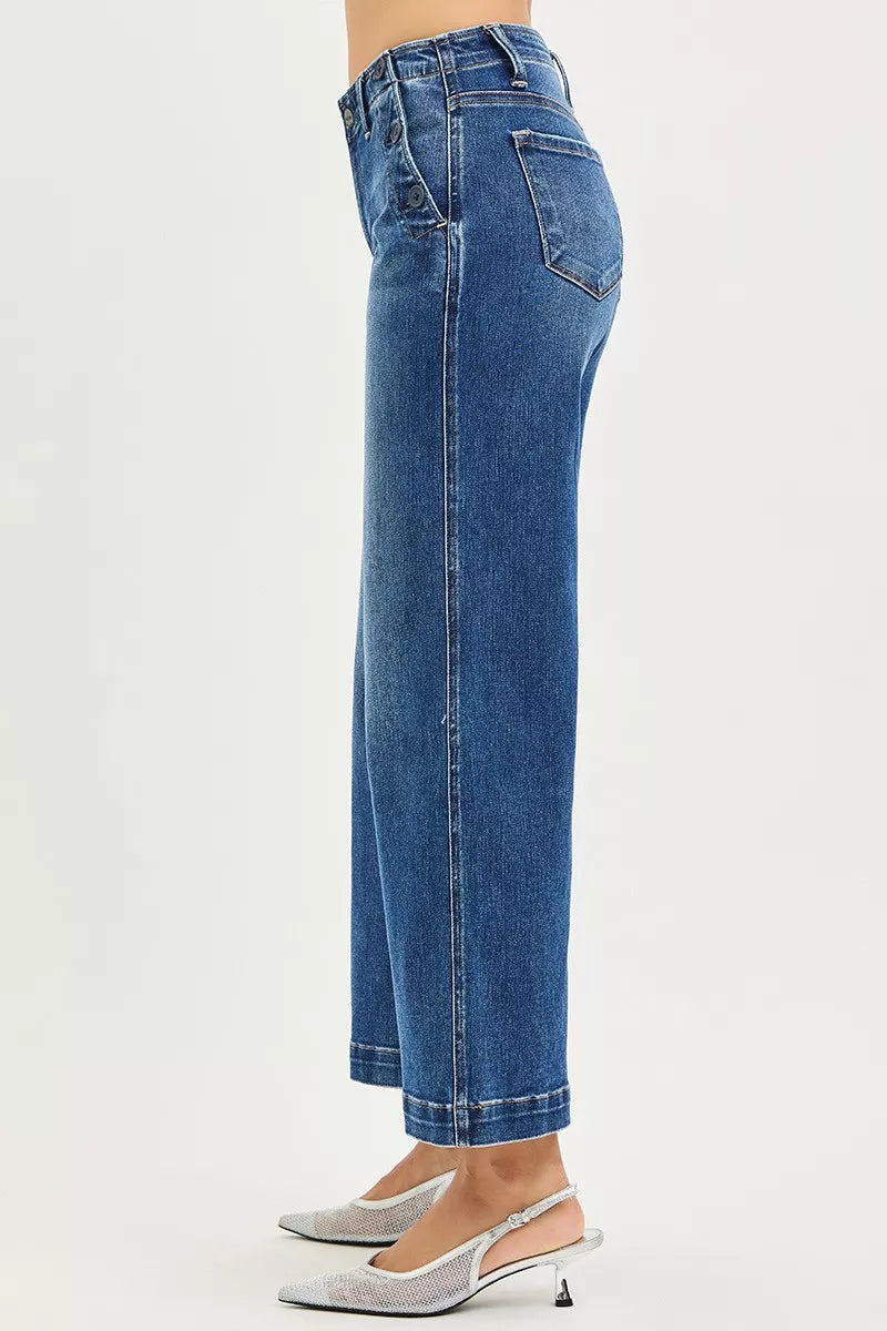 Blue jeans worn by a person on a white background