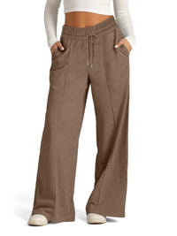 Brown wide-leg pants worn by a person on a white background