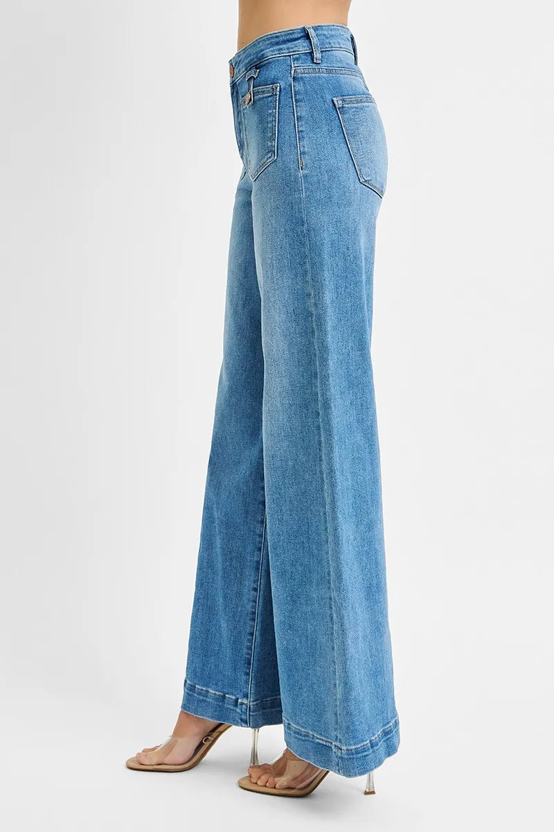 Blue jeans worn by a person on a white background