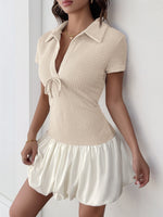 Woman wearing a beige dress with a white background