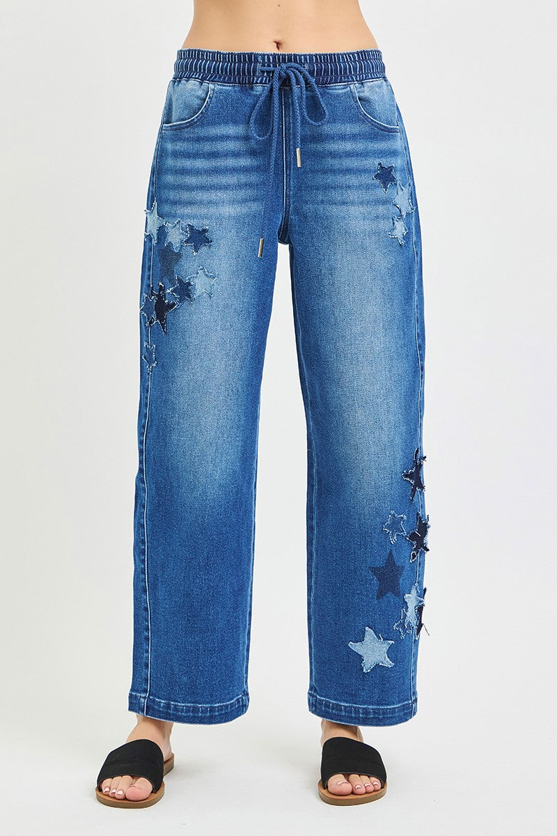 Blue jeans with star patterns on a white background