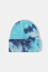 Tie-dye beanie with blue and black pattern on a white background