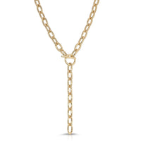 A gold-colored toggle lariat necklace with a bold 28-inch length and an 5-inch drop, crafted from recycled brass.