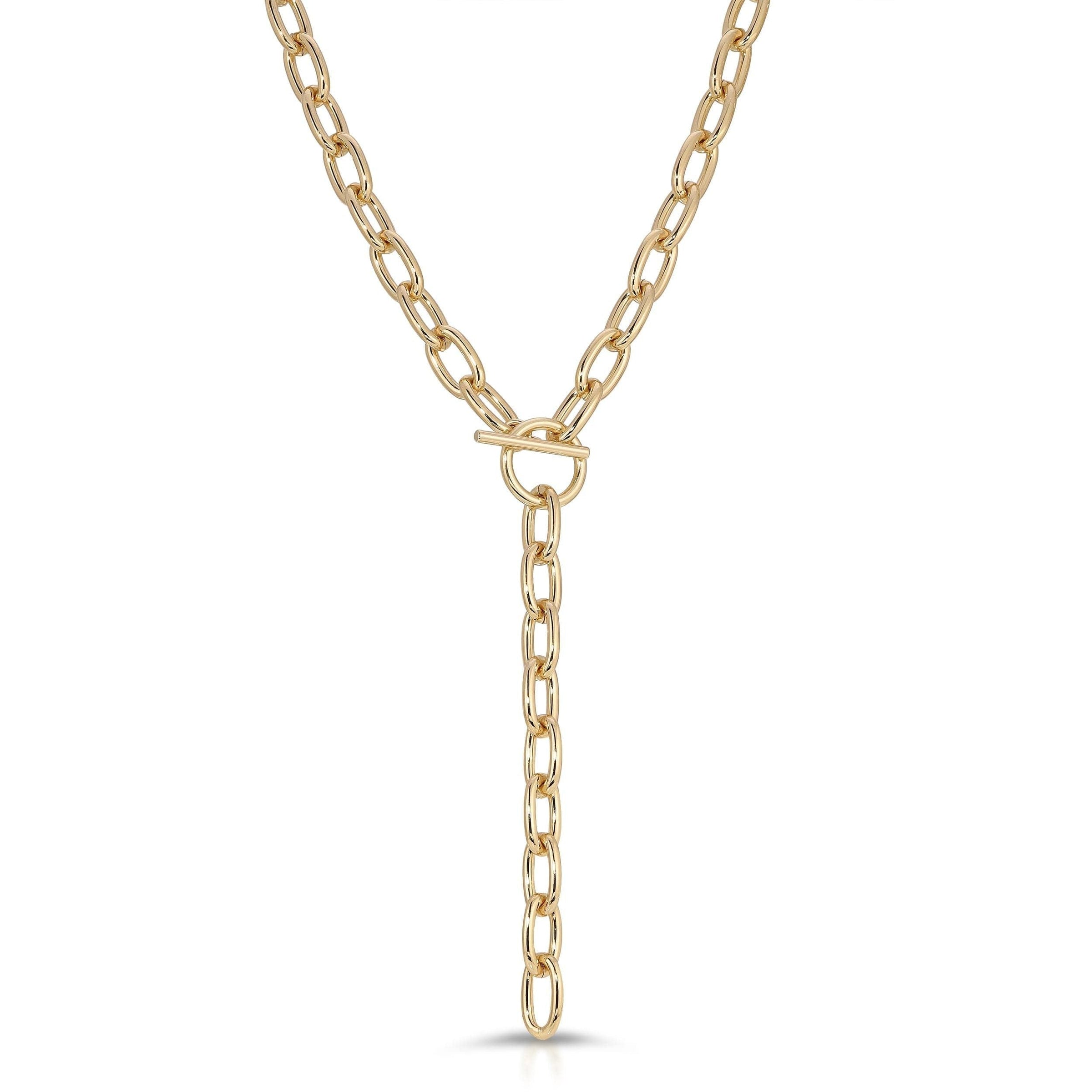 A gold-colored toggle lariat necklace with a bold 28-inch length and an 5-inch drop, crafted from recycled brass.