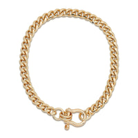 A gold-colored rounded Cuban link chain necklace with a horseshoe clasp.