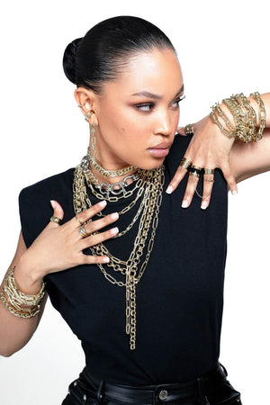 Model wearing lots of jewelry including Arya Bracelet