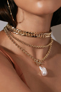 Model wearing three Arya Necklace