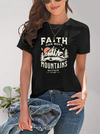 Person wearing a black t-shirt with 'Faith Can Move Mountains' graphic design.