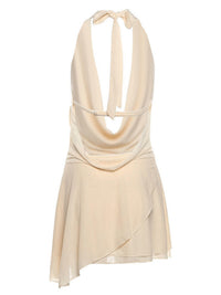 Beige halter neck dress on a white background