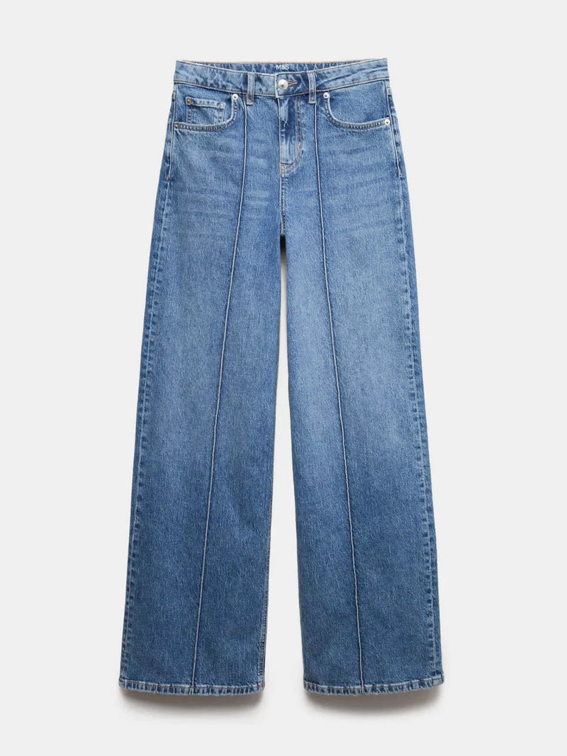 Pair of blue jeans on a light gray background