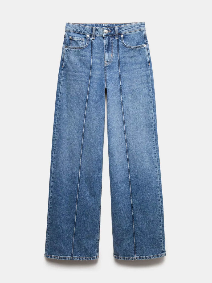 Pair of blue jeans on a light gray background