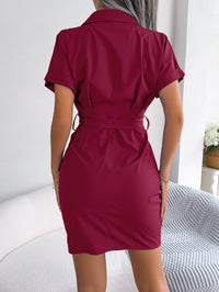 Woman wearing a burgundy dress with a white background