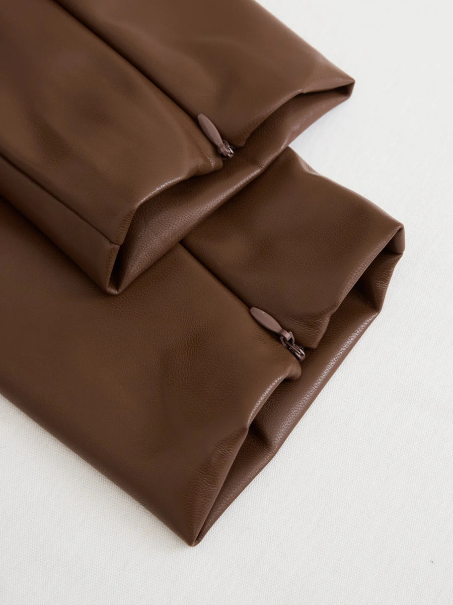 Folded brown fabric on a white background
