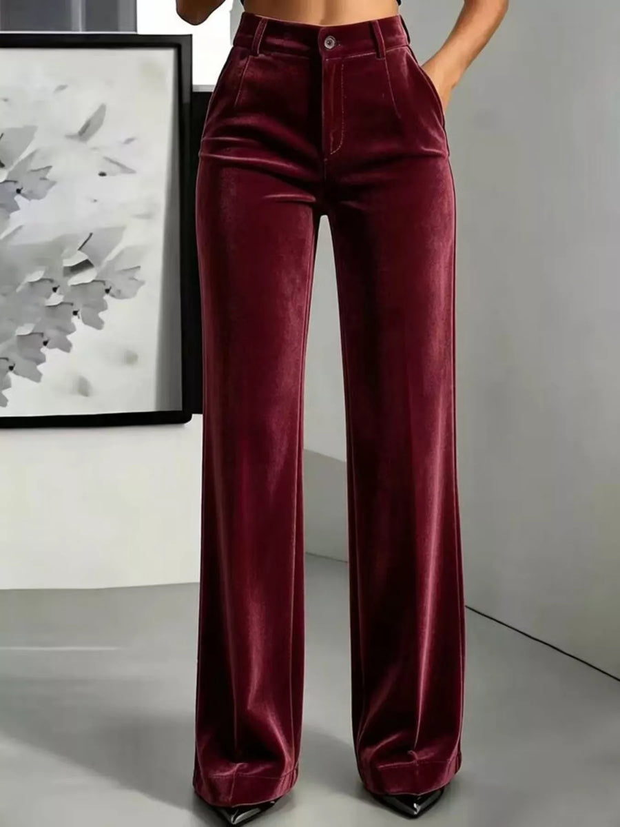 A front view of a lady wearing burgundy Full Size High-Waisted Velvet Pants Plus Size