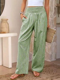 Person wearing green checkered pants in a casual setting
