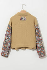 Beige jacket with floral sleeves on a white background