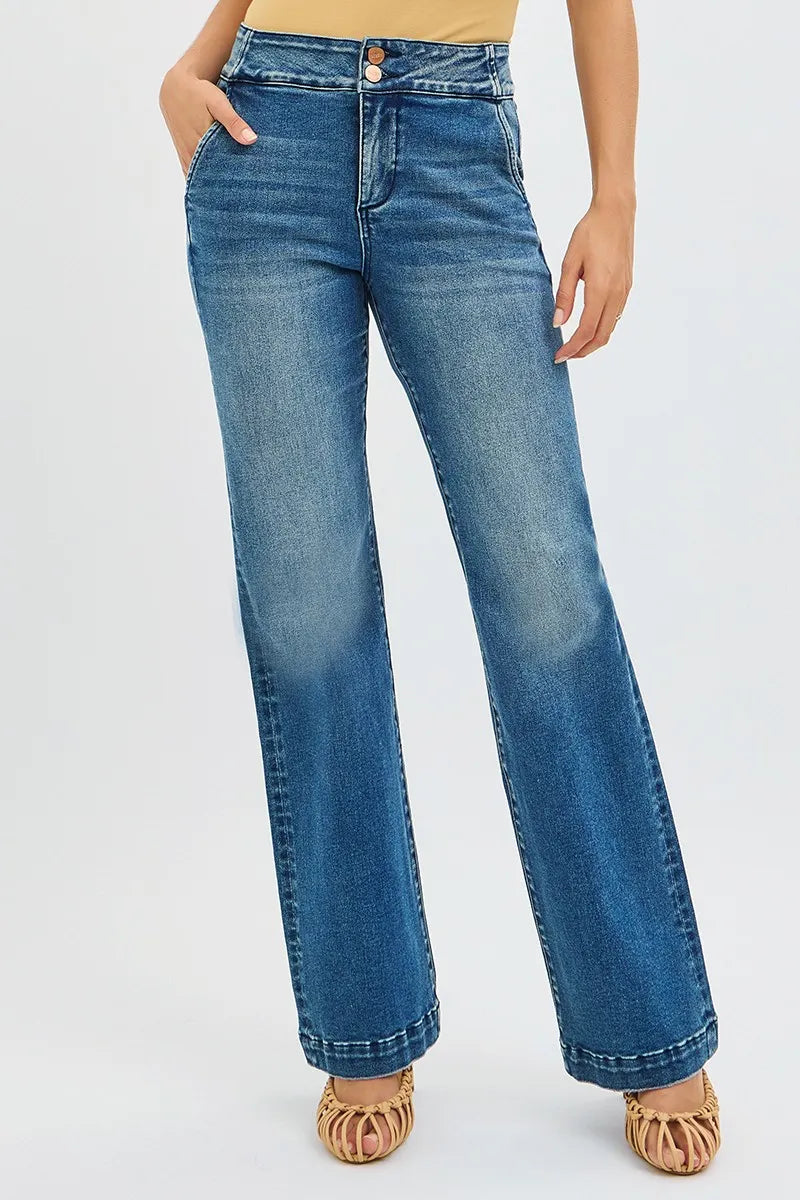 Blue jeans worn by a person on a white background