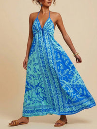 Woman wearing a blue floral dress against a beige background