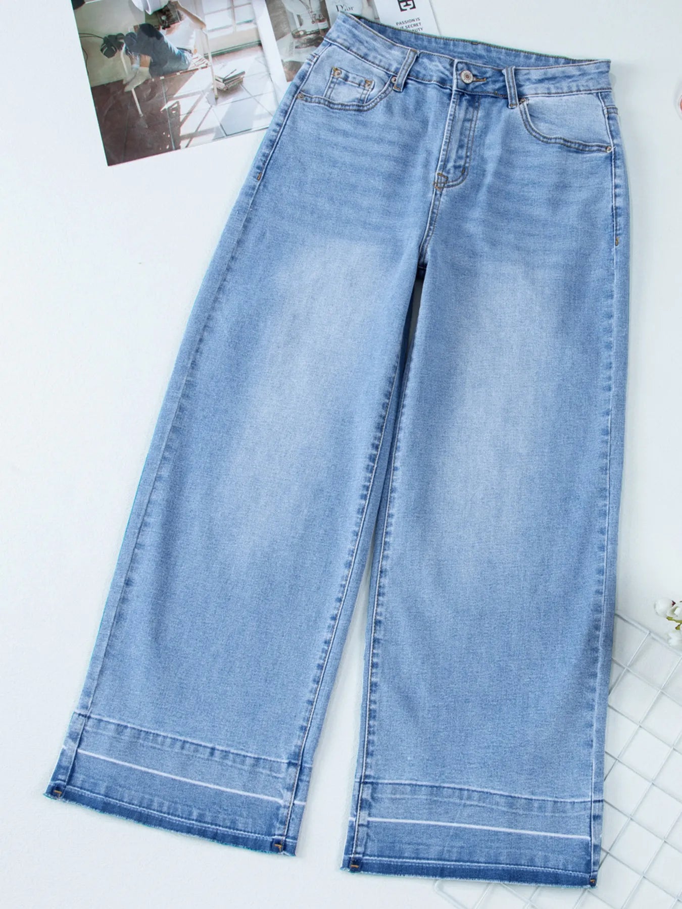 Light blue jeans on a white background