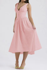 Pink dress worn by a model on a white background
