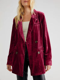 Maroon corduroy jacket worn by a person on a white background