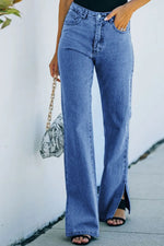 Person wearing blue jeans with a white wall background