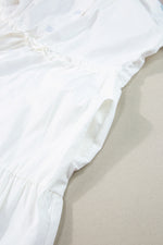Close up view of hem on Contrast Trim Button Up Short Sleeve Dress