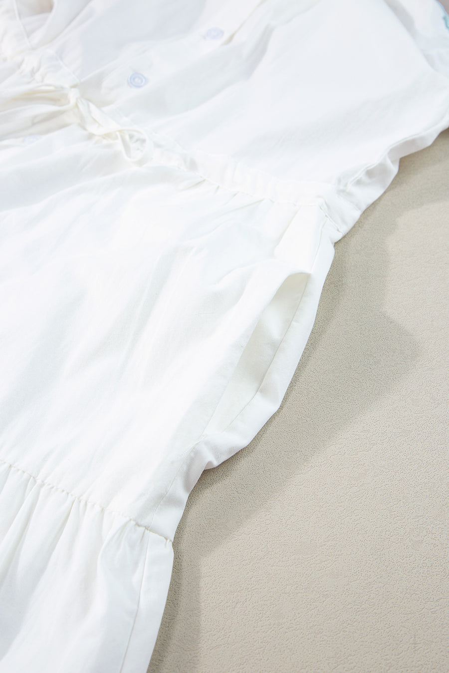 Close up view of hem on Contrast Trim Button Up Short Sleeve Dress