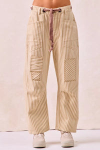 Beige striped pants with a drawstring on a white background