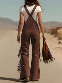Person wearing brown fringed overalls in a desert setting