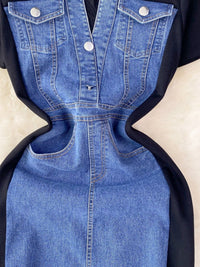 Blue denim dress with black accents on a beige background
