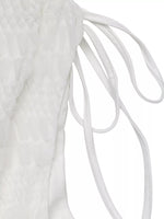 Close-up of white shoelaces on a white background